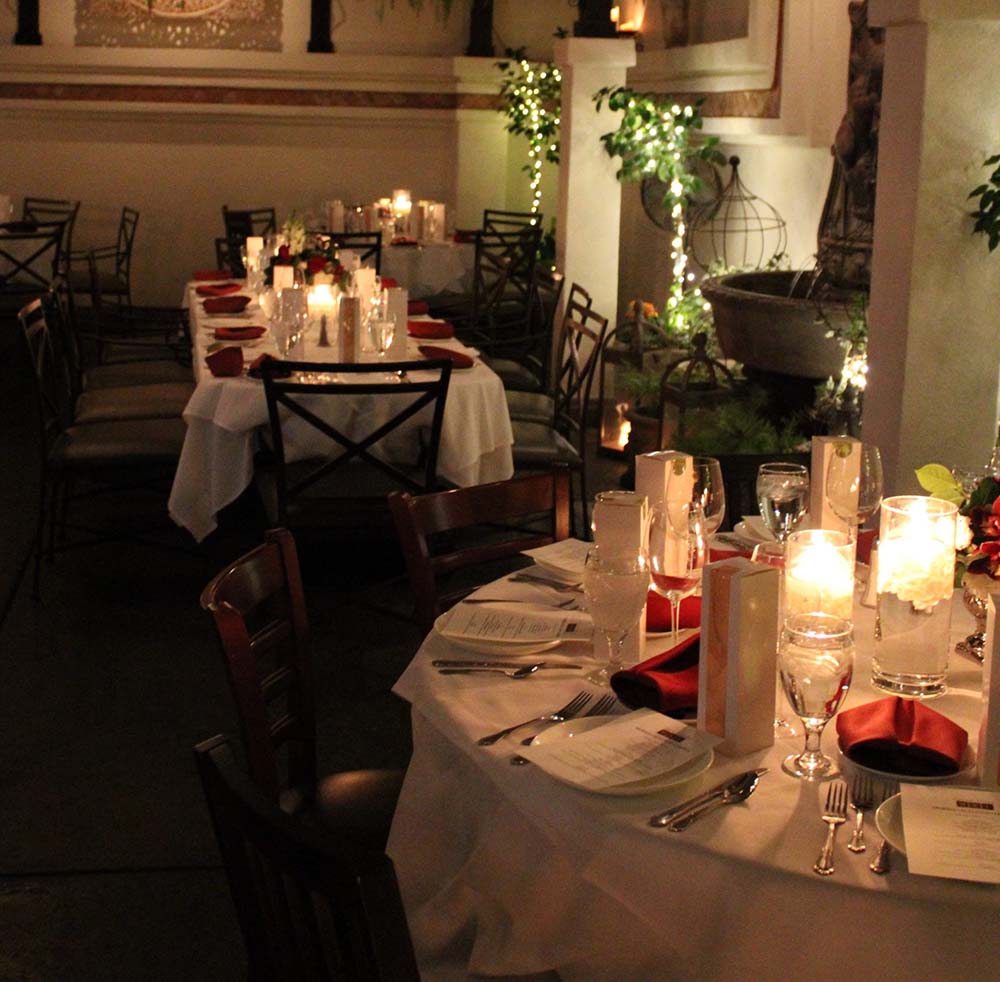 Candlelit dining tables at 20th Anniversary dinner